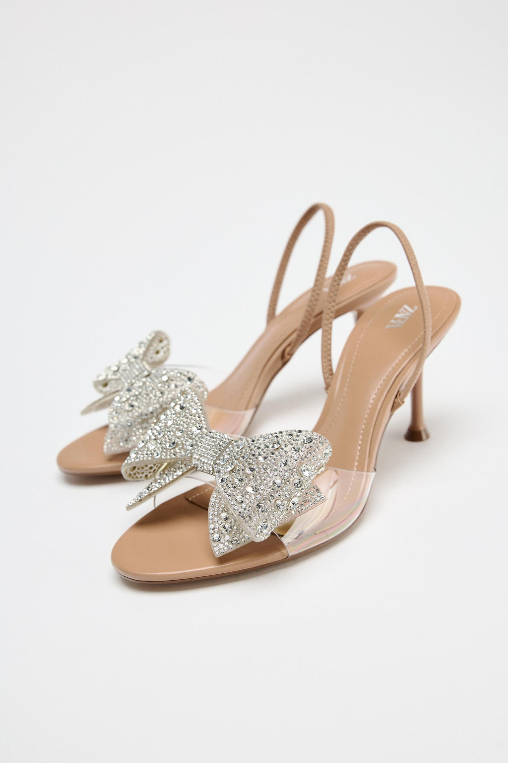 IMPORTED HEELS WITH SHINNY BOW