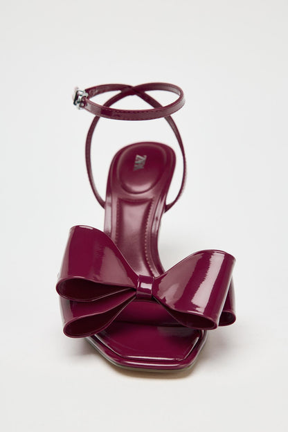 BURGUNDY PATENT BOW HEELS