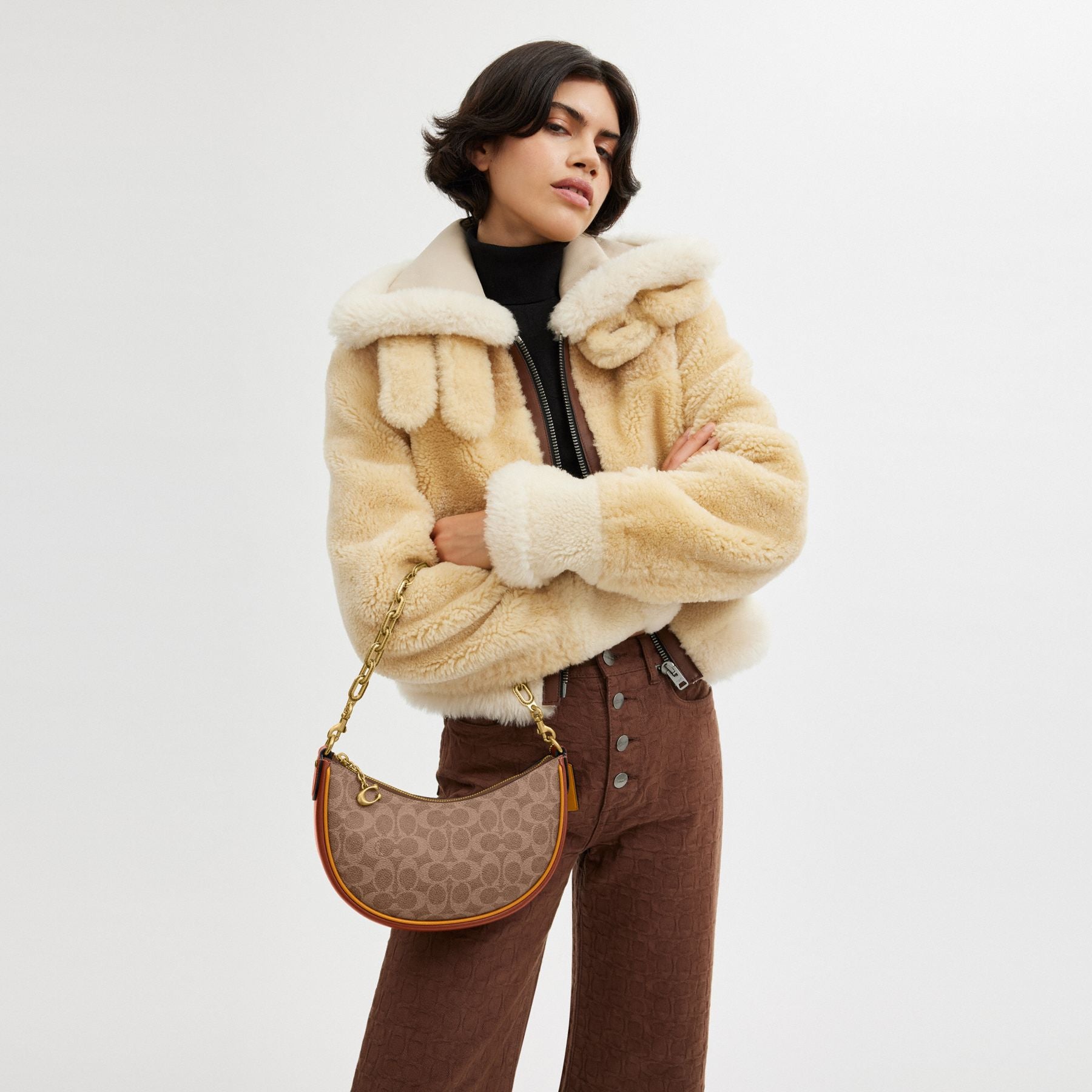 MIRA SHOULDER BAG IN SIGNATURE CANVAS