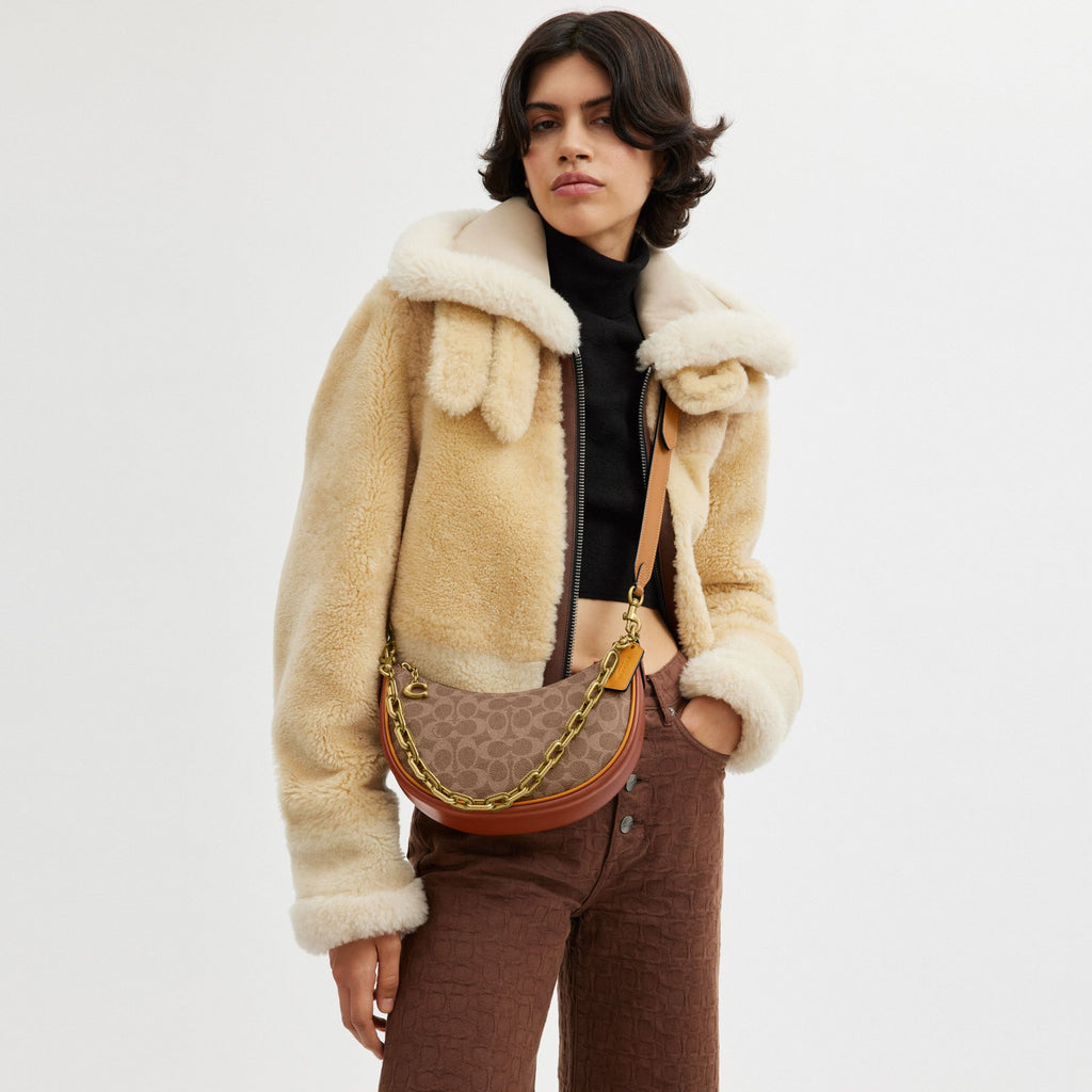 MIRA SHOULDER BAG IN SIGNATURE CANVAS