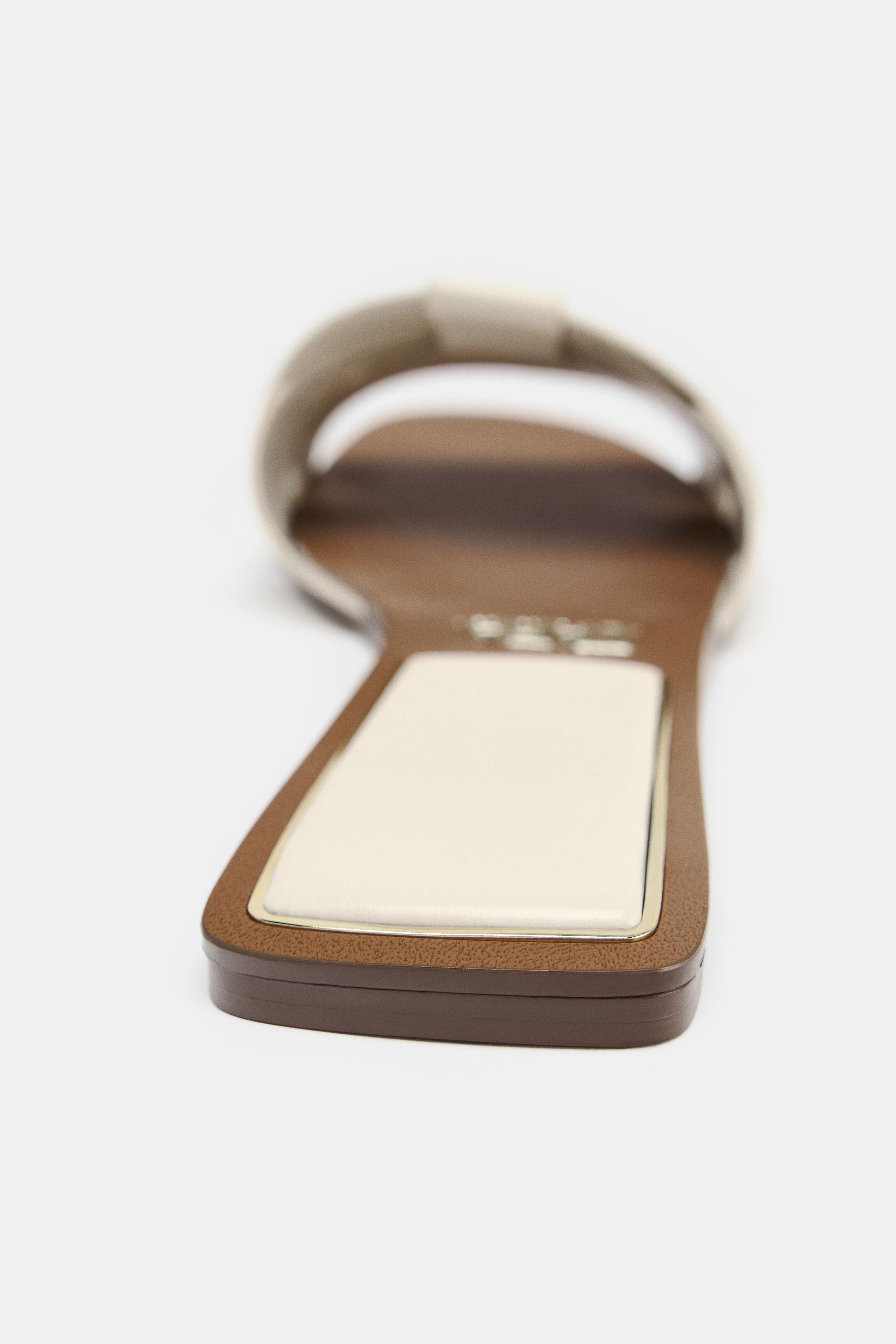 FLAT CROSSED LEATHER SANDALS
